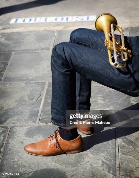 low section of street musician with trumpet, new orleans, louisiana, usa - trumpet fotografías e imágenes de stock