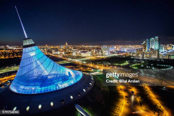 illuminated khan shatyr entertainment center at night, astana, kazakhstan - kazajistán fotografías e imágenes de stock