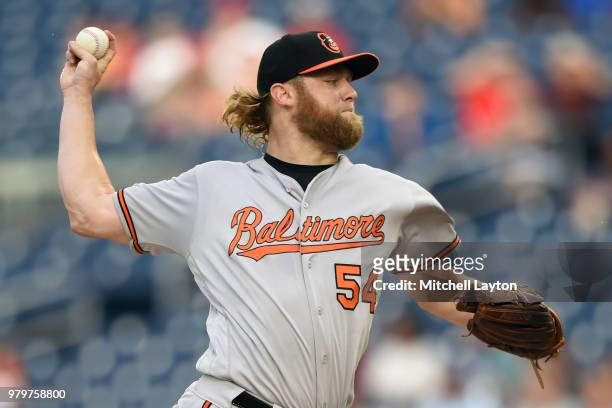 Andrew Cashner of the Baltimore Orioles pitches in the first inning during a baseball game against the Washington Nationals at Nationals Park on June...