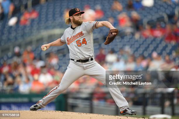 Andrew Cashner of the Baltimore Orioles pitches in the first inning during a baseball game against the Washington Nationals at Nationals Park on June...