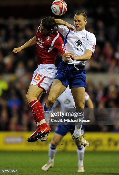 Chris Cohen of Nottingham Forest challenges Clint Hill of Crystal Palace during the Coca Cola Championship match between Nottingham Forest and...