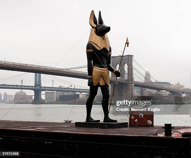 Foot Anubis statue rides on a barge to signal the one month countdown to the return of the "Tutankhamun and the Golden Age of the Pharaohs" exhibit...