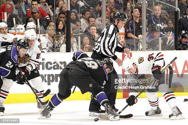 Jarret Stoll of the Los Angeles Kings faces off against Dave Bolland the Chicago Blackhawks during the game on March 18, 2010 at Staples Center in...