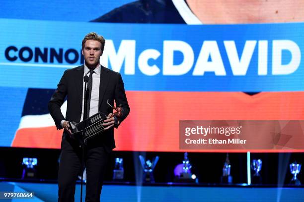 Connor McDavid of the Edmonton Oilers accepts the Ted Lindsay Award, given to the most outstanding player as voted by the NHLPA, at the 2018 NHL...