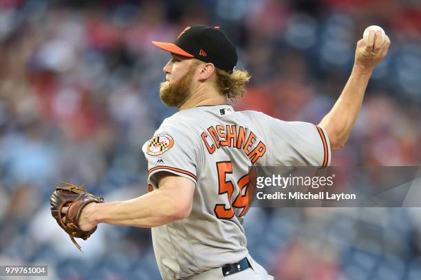 Andrew Cashner of the Baltimore Orioles pitches in the third inning during a baseball game against the Washington Nationals at Nationals Park on June...