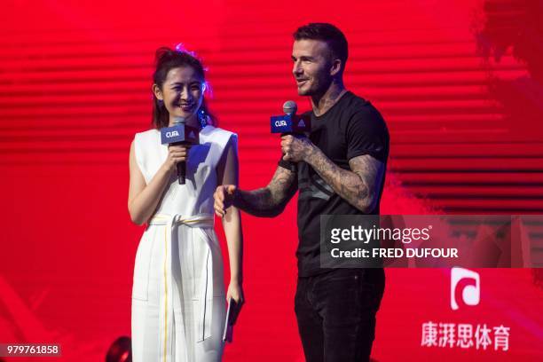 In this photo taken on June 20 former England footballer David Beckham attends a promotional event for a sportswear company and a collegiate football...