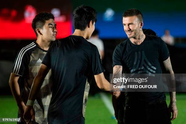 In this photo taken on June 20 former England footballer David Beckham attends a promotional event for a sportswear company and a collegiate football...