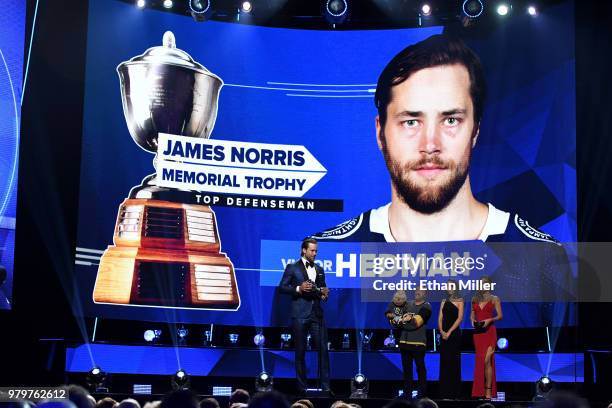 Victor Hedman of the Tampa Bay Lightning accepts the James Norris Memorial Trophy given to the top defenseman onstage at the 2018 NHL Awards...