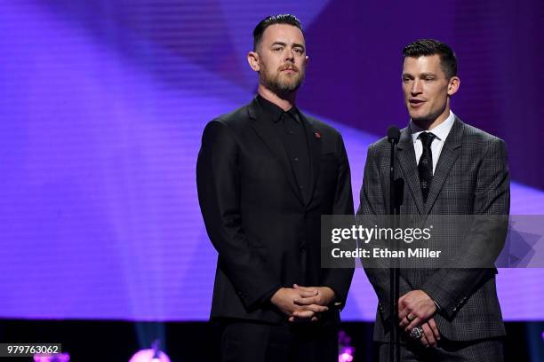 Actor Colin Hanks and former NHL player Andrew Ference present an award onstage at the 2018 NHL Awards presented by Hulu at The Joint inside the Hard...