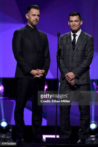 Actor Colin Hanks and former NHL player Andrew Ference present an award onstage at the 2018 NHL Awards presented by Hulu at The Joint inside the Hard...