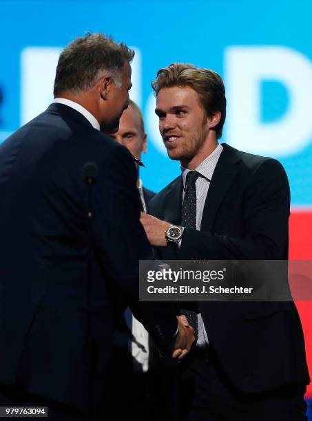 Connor McDavid of the Edmonton Oilers accepts the Ted Lindsay Award given to the most outstanding player as voted by the NHLPA from Eric Lindros at...