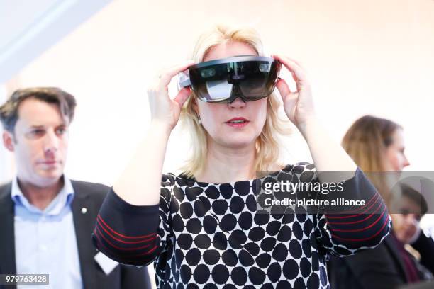 March 2018, Germany, Rostock: Manuela Schwesig, Premier of the Social Democratic Party of Mecklenburg-Western Pomerania, wearing a pair of HoLo Lens...