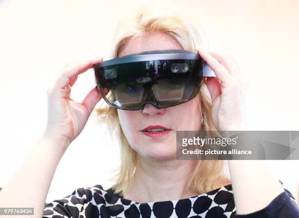 March 2018, Germany, Rostock: Manuela Schwesig, Premier of the Social Democratic Party of Mecklenburg-Western Pomerania, wearing a pair of HoLo Lens...