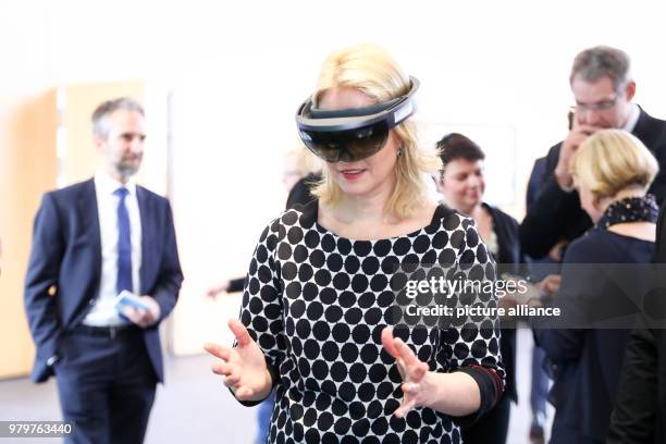 March 2018, Germany, Rostock: Manuela Schwesig, Premier of the Social Democratic Party of Mecklenburg-Western Pomerania, wearing a pair of HoLo Lens...