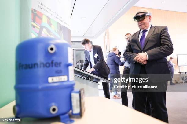 March 2018, Germany, Rostock: Till Backhaus of the Social Democratic Party , Minister of Agriculture of Mecklenburg-Western Pomerania, wearing a pair...