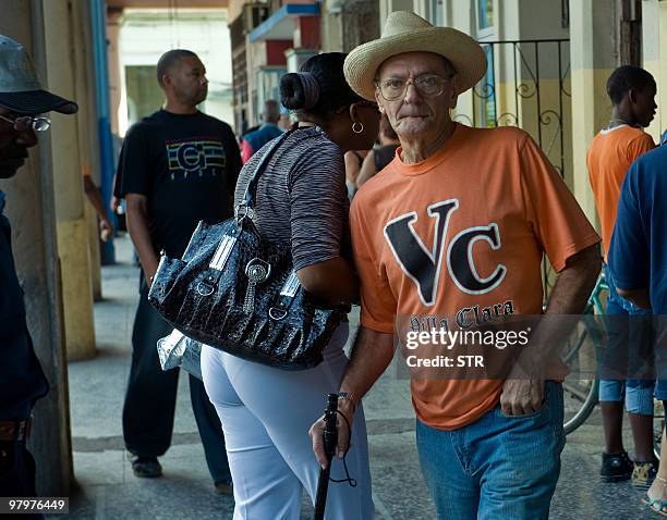 Baseball fan wears a t-shirt of his team Villa Clara, on March 23, 2010 in Havana before the start of the 49th Baseball National Series final between...