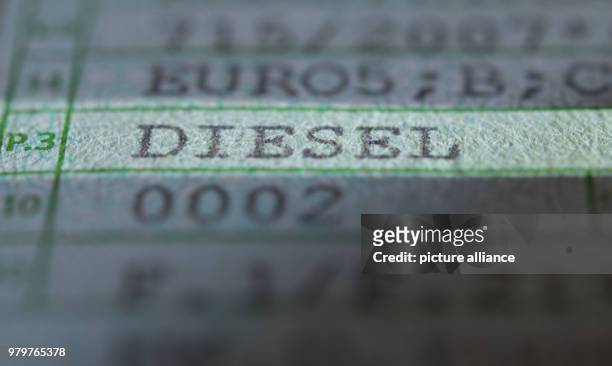 March 2018, Germany, Stuttgart: The words 'Diesel' and 'Euro5' are printed on a registration certificate of a car of the model Volkswagen T5. Photo:...