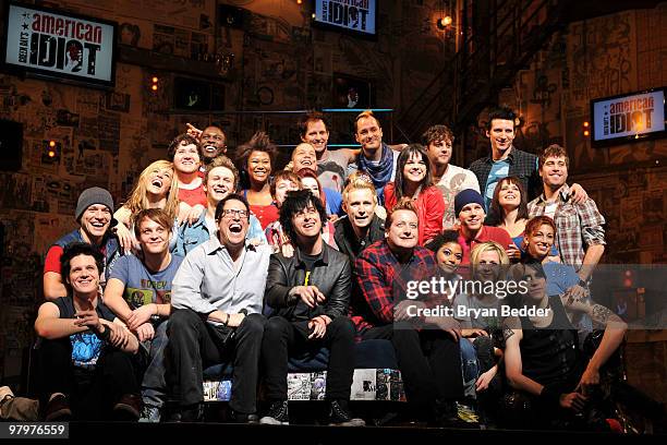 Director Michael Mayer, musicians Billie Joe Armstrong, Mike Dirnt and Tre Cool of the band Green Day pose with the cast of Broadway's "American...