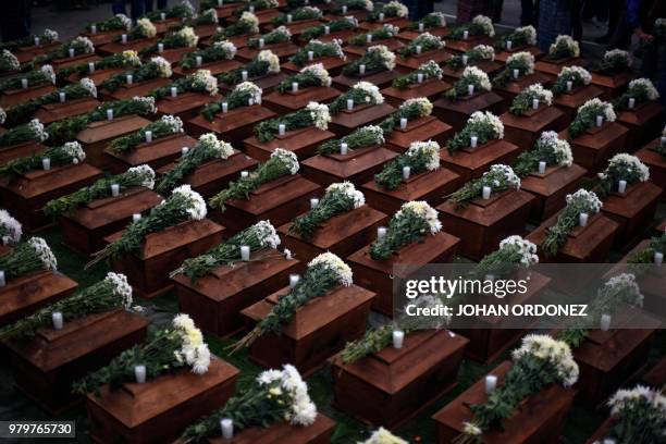 View of some of the 172 urns containing the remains of victims of the Guatemalan armed conflict , before being buried in San Juan Comalapa...