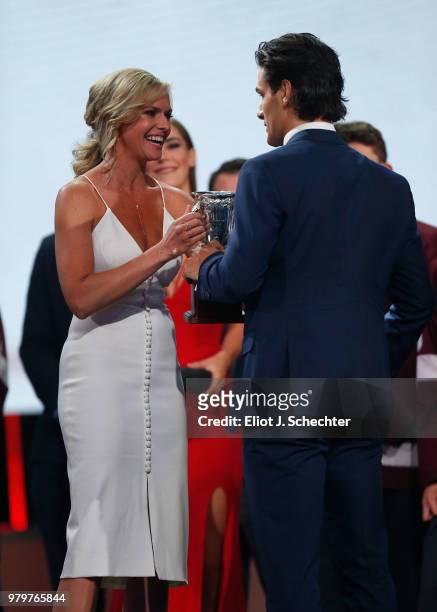 Matthew Barzal of the New York Islanders accepts the Calder Memorial Trophy from NHL Network presenter Kathryn Tappen during the 2018 NHL Awards...