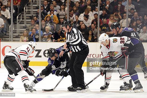 Jarret Stoll of the Los Angeles Kings faces off against John Madden Chicago Blackhawks during the game on March 18, 2010 at Staples Center in Los...