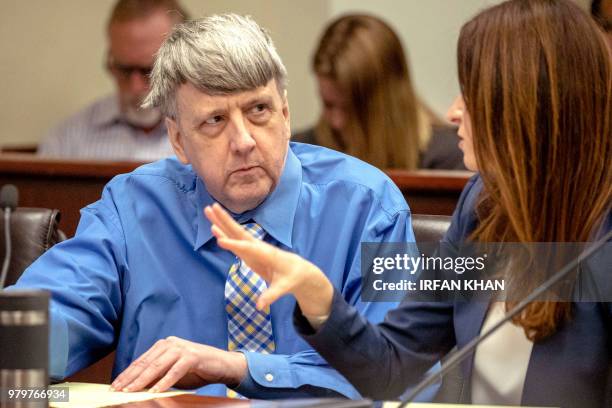 Defendant David Turpin listens to his attorney Allison Lowe during a preliminary hearing on June 20, 2018 in Riverside. - The couple from Perris...