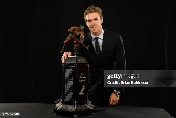 Connor McDavid of the Edmonton Oilers poses for a portrait with the Ted Lindsay Award at the 2018 NHL Awards at the Hard Rock Hotel & Casino on June...