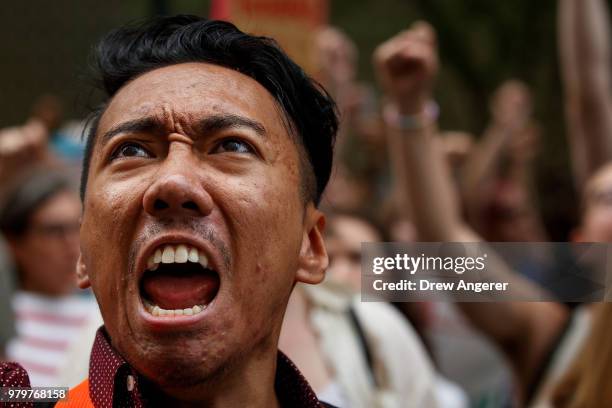 Activists shout toward the U.S. Mission to the United Nations while rallying in support immigrants and to mark World Refugee Day, June 20, 2018 in...