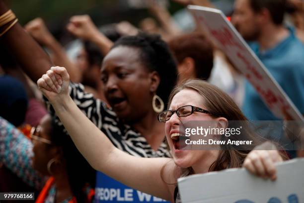 Activists rally outside of Trump World Tower to support immigrants and to mark World Refugee Day, June 20, 2018 in New York City. Bowing to political...
