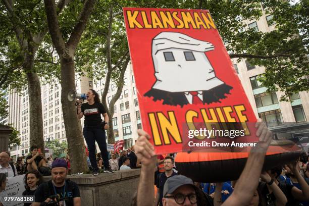 Activists rally to support immigrants and to mark World Refugee Day, June 20, 2018 in Midtown Manhattan in New York City. Bowing to political...