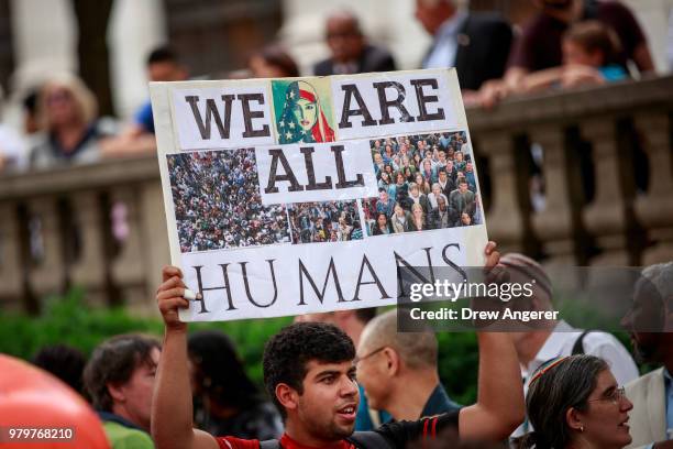Activists rally to support immigrants and to mark World Refugee Day, June 20, 2018 in Midtown Manhattan in New York City. Bowing to political...