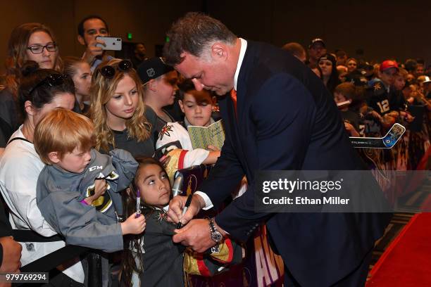Former NHL player Eric Lindros signs autographs for fans as he arrives at the 2018 NHL Awards presented by Hulu at the Hard Rock Hotel & Casino on...