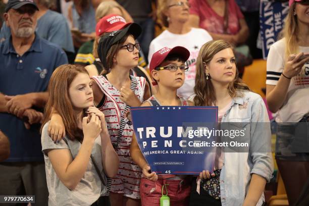 Supporters wait for the start of a campaign rally with President Donald Trump at the Amsoil Arena on June 20, 2018 in Duluth Minnesota. Earlier today...