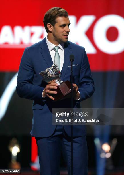 Anze Kopitar of the Los Angeles Kings accepts the Frank J. Selke Trophy onstage during the 2018 NHL Awards presented by Hulu at The Joint inside the...