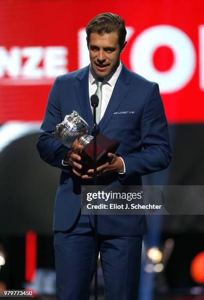 Anze Kopitar of the Los Angeles Kings accepts the Frank J. Selke Trophy onstage during the 2018 NHL Awards presented by Hulu at The Joint inside the...