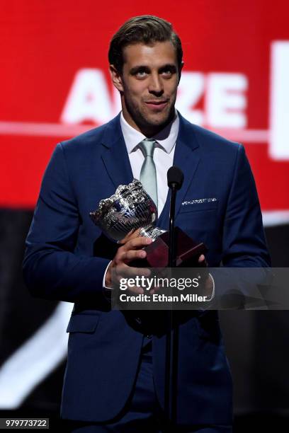 Anze Kopitar of the Los Angeles Kings accepts the Frank J. Selke trophy, given to the top defensive forward, onstage at the 2018 NHL Awards presented...