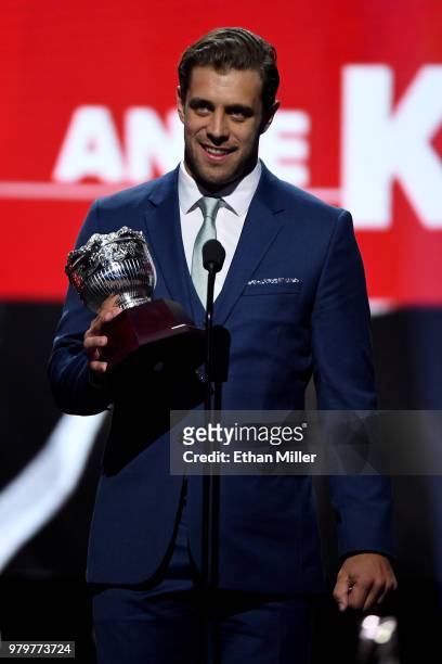 Anze Kopitar of the Los Angeles Kings accepts the Frank J. Selke trophy, given to the top defensive forward, onstage at the 2018 NHL Awards presented...