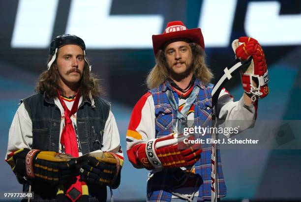 Ryan Russell and Steve Campbell, known as Jacob Ardown and Olly Postanin, from 'On the Bench' speak onstage during the 2018 NHL Awards presented by...