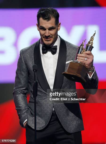 Brian Boyle of the New Jersey Devils accepts the Bill Masterton Memorial Trophy for perseverance and dedication to hockey onstage at the 2018 NHL...