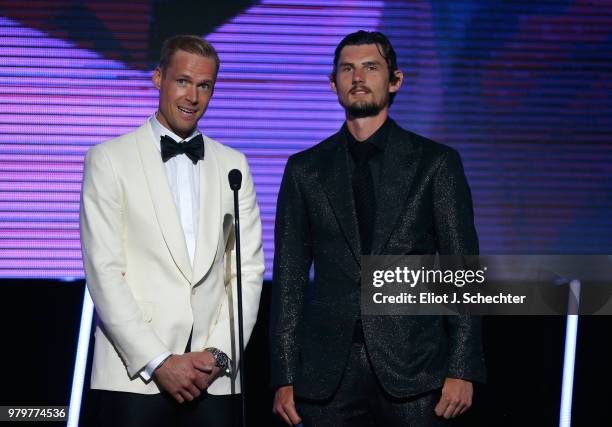 Pekka Rinne of the Nashville Predators and Connor Hellebuyck of the Winnipeg Jets speak onstage during the 2018 NHL Awards presented by Hulu at The...