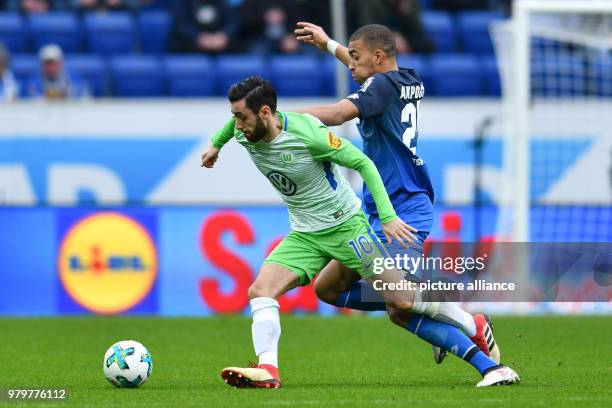 March 2018, Sinsheim, Germany: Bundesliga football, TSG 1899 Hoffenheim vs VfL Wolfsburg at the Rhein-Neckar-Arena. Wolfsburg's Yunus Malli and...