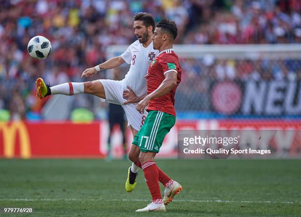 Joao Moutinho of Portugal competes for the ball with Nabil Dirar of Marocco during the 2018 FIFA World Cup Russia group B match between Portugal and...