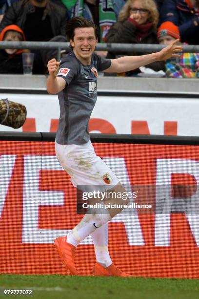 March 2018, Hanover, Germany: Bundesliga football, Hannover 96 vs FC Augsburg at the HDI-Arena. Augsburg's Michael Gregoritsch celebrates after his...