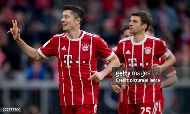 March 2018, Munich, Germany: Bundesliga football, Bayern Munich vs Hamburg SV at the Allianz Arena. Bayern's Robert Lewandowski celebrates with...