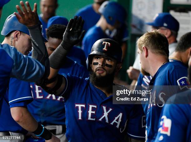 Rougned Odor of the Texas Rangers celebrates his home run with teammates in the sixth inning against the Kansas City Royals at Kauffman Stadium on...