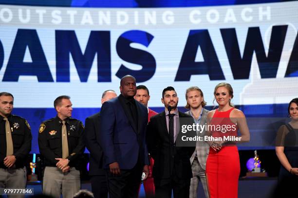 Player Kevin Weekes, UNLV hockey assistant coach Nick Robone, a Las Vegas shooting survivor, and NHL Network host Jamie Hersch present the Jack Adams...