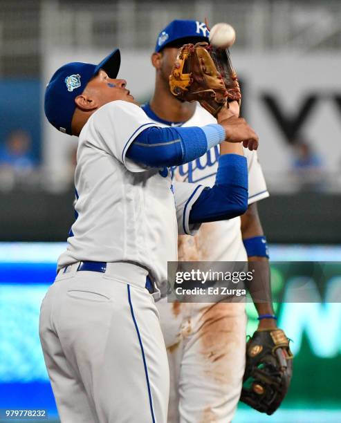 Ryan Goins of the Kansas City Royals catches a ball hit by Carlos Tocci of the Texas Rangers in the sixth inning at Kauffman Stadium on June 20, 2018...