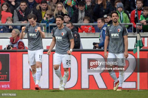 March 2018, Hanover, Germany: Bundesliga football, Hannover 96 vs FC Augsburg at the HDI-Arena. Augsburg's goalscorers Michael Gregoritsch and Gojko...