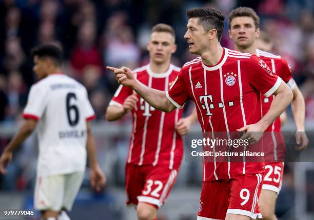 March 2018, Munich, Germany: Bundesliga football, Bayern Munich vs Hamburg SV at the Allianz Arena. Munich's Robert Lewandowski celebrates with...