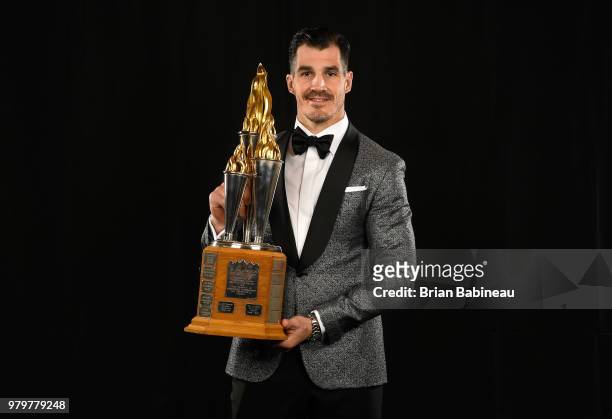 Brian Boyle of the New Jersey Devils poses for a portrait with the Bill Masterton Memorial Trophy at the 2018 NHL Awards at the Hard Rock Hotel &...